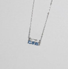 Silver necklace with three round blue zirconia stones