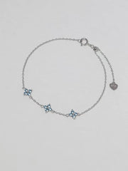 Clover Bracelet in silver with three pale blue four-petal floral stones