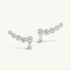 Line Earrings in silver with five graduated bezel-set zirconia stones and a dangling round stone