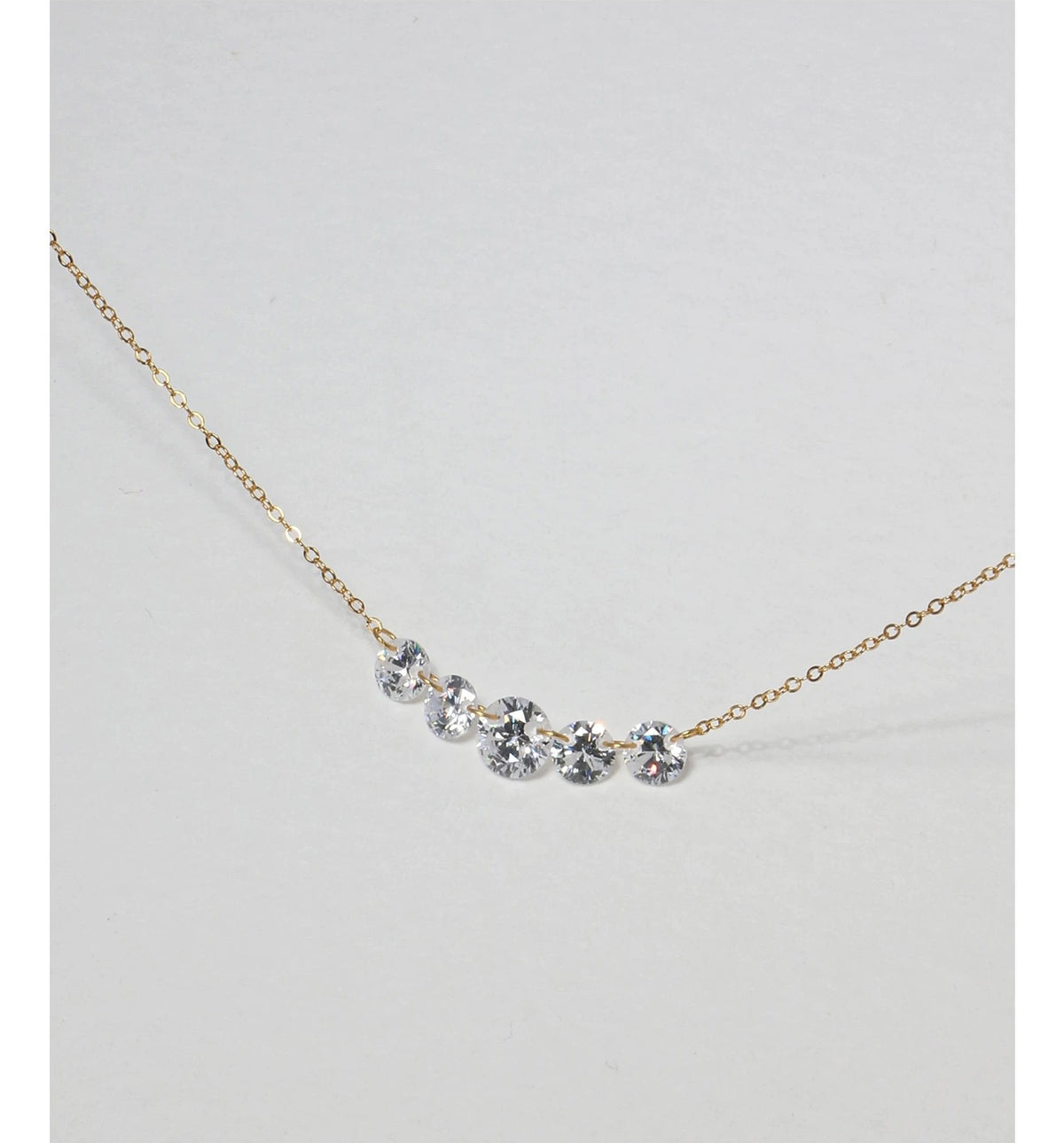 Lumière Rivière Necklace in gold with five graduated round zirconia stones