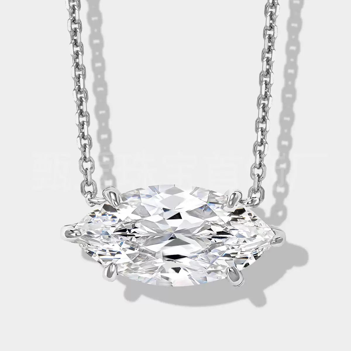 Marquise Necklace close-up with horizontal marquise-cut clear stone in silver setting