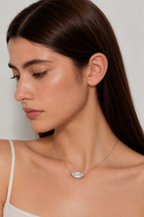 Model wearing Marquise Necklace with a 4.5-carat-look marquise-cut clear stone, no earrings