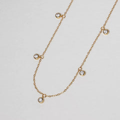 Pluie de Lumière Necklace in gold with five bezel-set zirconia drops